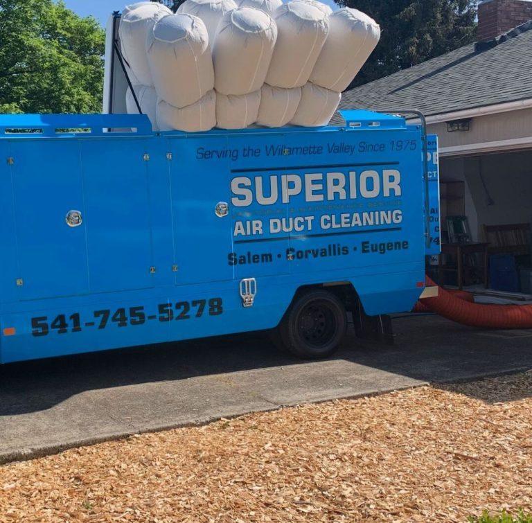 Superior air duct cleaning truck with ducting stacked on the roof